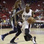 Portland Trail Blazers' Archie Goodwin drives around Memphis Grizzlies' Dee Bost during the second half of an NBA summer league basketball game Monday, July 16, 2018, in Las Vegas. (AP Photo/John Locher)