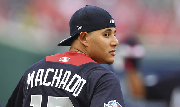 American League, Baltimore Orioles shortstop Manny Machado looks over his shoulder as he walks onto...