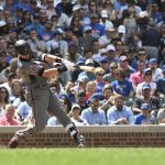 Arizona Diamondbacks' Nick Ahmed hits a grand slam during the fifth inning of a baseball game  against the Chicago Cubs, Thursday, July 26, 2018, in Chicago. (AP Photo/David Banks)