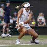 Angelique Kerber of Germany returns the ball to Serena Williams of the US during the women's singles final match at the Wimbledon Tennis Championships, in London, Saturday July 14, 2018. (Nic Bothma, Pool via AP)