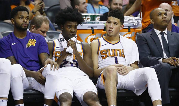 Phoenix Suns center Alex Len, from left, guard Troy Daniels, forward Josh Jackson and guard Devin B...