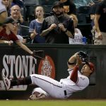 Arizona Diamondbacks center fielder Jon Jay makes a sliding catch on a foul ball hit by San Diego Padres' Cory Spangenberg during the eighth inning of a baseball game Thursday, July 5, 2018, in Phoenix. The Padres defeated the Diamondbacks 6-3. (AP Photo/Ross D. Franklin)