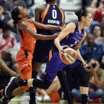 Connecticut Sun guard Jasmine Thomas runs into a screen from Phoenix Mercury forward Angel Robinson (0) while pursuing Diana Taurasi (3) during the first half of a WNBA basketball game Friday, July 13, 2018, in Uncasville, Conn.. (Sean D. Elliot/The Day via AP)