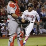 Arizona Diamondbacks' Jon Jay (9) scores on a single by Jake Lamb during the fourth inning of the team's baseball game against the St. Louis Cardinals, Wednesday, July 4, 2018, in Phoenix. (AP Photo/Rick Scuteri)