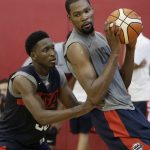 Kevin Durant drives into Victor Oladipo during a training camp for USA Basketball, Friday, July 27, 2018, in Las Vegas. (AP Photo/John Locher)