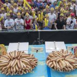 
              Hot dogs are on display on stage ahead of the Nathan's Famous Fourth of July hot dog eating contest, Wednesday, July 4, 2018, in New York's Coney Island. (AP Photo/Mary Altaffer)
            