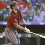 Arizona Diamondbacks' Paul Goldschmidt watches his solo home run off Colorado Rockies starting pitcher German Marquez during the first inning of a baseball game Wednesday, July 11, 2018, in Denver. (AP Photo/David Zalubowski)