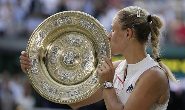 Germany's Angelique Kerber kisses the trophy after winning the women's singles final match against ...