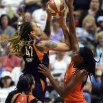 Phoenix Mercury center Brittney Griner is fouled by Connecticut Sun center Jonquel Jones during a WNBA basketball game Friday, July 13, 2018, in Uncasville, Conn. (Sean D. Elliot/The Day via AP)