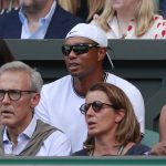 Tiger Woods sits in the player's box of Serena Williams during the women's singles final match between Serena Williams of the US and Angelique Kerber of Germany at the Wimbledon Tennis Championships, in London, Saturday July 14, 2018. (Andrew Couldridge, Pool via AP)