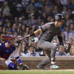 Arizona Diamondbacks' Jake Lamb watches his RBI single off Chicago Cubs starting pitcher Kyle Hendricks during the fifth inning of a baseball game Tuesday, July 24, 2018, in Chicago. (AP Photo/Charles Rex Arbogast)