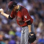 Arizona Diamondbacks relief pitcher Yoshihisa Hirano waits to be pulled from the mound after giving up an RBI-single to Colorado Rockies' Charlie Blackmon during the fourth inning of a baseball game Wednesday, July 11, 2018, in Denver. (AP Photo/David Zalubowski)