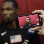 A reporter takes video of Kevin Durant during a training camp for USA basketball, Thursday, July 26, 2018, in Las Vegas. (AP Photo/John Locher)