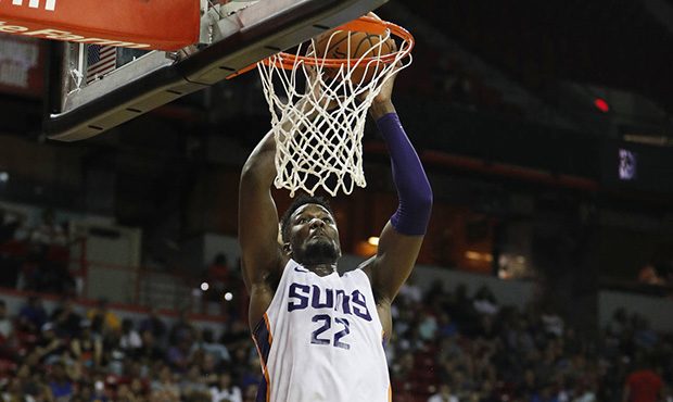 Phoenix Suns' Deandre Ayton dunks against the Dallas Mavericks during the second half of an NBA sum...