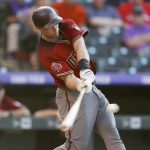 Arizona Diamondbacks' Paul Goldschmidt swings for a solo home run off Colorado Rockies starting pitcher German Marquez during the first inning of a baseball game Wednesday, July 11, 2018, in Denver. (AP Photo/David Zalubowski)