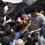 Devin Booker meets with fans during a training camp for USA Basketball, Friday, July 27, 2018, in Las Vegas. (AP Photo/John Locher)