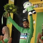Slovakia's Peter Sagan, wearing the best sprinter's green jersey, celebrates on the podium after the twentieth stage of the Tour de France cycling race, an individual time trial over 31 kilometers (19.3 miles)with start in Saint-Pee-sur-Nivelle and finish in Espelette, France, Saturday July 28, 2018. (AP Photo/Peter Dejong)