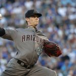 Arizona Diamondbacks starting pitcher Clay Buchholz delivers during the first inning of the team's baseball game against the Chicago Cubs on Tuesday, July 24, 2018, in Chicago. (AP Photo/Charles Rex Arbogast)