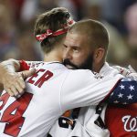 Washington Nationals Bryce Harper (34) hugs his dad Ron Harper during the MLB Home Run Derby, at Nationals Park, Monday, July 16, 2018 in Washington. The 89th MLB baseball All-Star Game will be played Tuesday. (AP Photo/Alex Brandon)