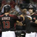 Arizona Diamondbacks' Paul Goldschmidt celebrates with Nick Ahmed (13) after hitting a three-run home run against the San Diego Padres in the fourth inning during a baseball game, Saturday, July 7, 2018, in Phoenix. (AP Photo/Rick Scuteri)