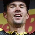 Stage winner Slovenia's Primoz Roglic celebrates on the podium after the nineteenth stage of the Tour de France cycling race over 200.5 kilometers (124.6 miles) with start in Lourdes and finish in Laruns, France, Friday July 27, 2018. (AP Photo/Christophe Ena )