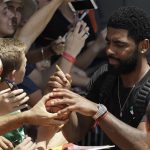 Kyrie Irving signs a basketball for a fan during a training camp for USA Basketball, Thursday, July 26, 2018, in Las Vegas. (AP Photo/John Locher)