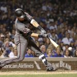 Arizona Diamondbacks' Nick Ahmed hits a pinch-hit RBI single off Chicago Cubs relief pitcher Randy Rosario during the eighth inning of a baseball game Monday, July 23, 2018, in Chicago. Jeff Mathis scored. (AP Photo/Charles Rex Arbogast)