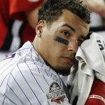 Chicago Cubs Javier Báez (9) wipes his face during the MLB Home Run Derby, at Nationals Park, Monday, July 16, 2018 in Washington. The 89th MLB baseball All-Star Game will be played Tuesday. (AP Photo/Alex Brandon)