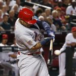 St. Louis Cardinals' Yadier Molina connects for a two-run single against the Arizona Diamondbacks during the first inning of a baseball game Monday, July 2, 2018, in Phoenix. (AP Photo/Ross D. Franklin)