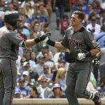 Arizona Diamondbacks' Nick Ahmed (13) is greeted by Alex Avila (5) after hitting a grand slam home run against the Chicago Cubs during the fifth inning of a baseball game, Thursday, July 26, 2018, in Chicago. (AP Photo/David Banks)