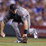 Arizona Diamondbacks first baseman Paul Goldschmidt tries to field a weak ground ball hit by Colorado Rockies' Ian Desmond but commits an error on the play to allow a runner to score from third during the fifth inning of a baseball game Tuesday, July 10, 2018, in Denver. (AP Photo/David Zalubowski)
