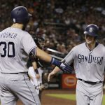 San Diego Padres' Wil Myers celebrates with Eric Hosmer (30) after hitting a solo home run against the Arizona Diamondbacks during the third inning during a baseball game Saturday, July 7, 2018, in Phoenix. (AP Photo/Rick Scuteri)