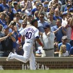 Chicago Cubs' Willson Contreras (40) runs back to the dugout after scoring against the Arizona Diamondbacks during the second inning of a baseball game, Thursday, July 26, 2018, in Chicago. (AP Photo/David Banks)