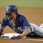 San Diego Padres' Carlos Asuaje dives into third base with a triple against the Arizona Diamondbacks during the first inning of a baseball game Thursday, July 5, 2018, in Phoenix. (AP Photo/Ross D. Franklin)