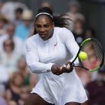 Serena Williams of the US returns a ball to Angelique Kerber of Germany during the women's singles final match at the Wimbledon Tennis Championships, in London, Saturday July 14, 2018. (Andrew Couldridge, Pool via AP)