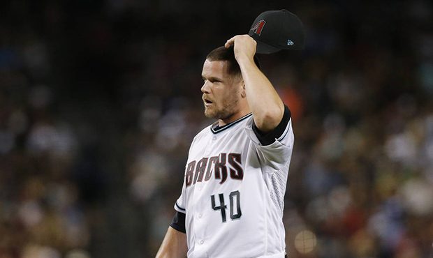 Arizona Diamondbacks relief pitcher Andrew Chafin pauses on the mound after giving up a run to the ...
