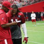 Cardinals receiver Larry Fitzgerald speaks to quarterbacks coach Byron Leftwich on Saturday, July 28, 2018, the first full day of Arizona's training camp. (Tyler Drake/Arizona Sports)