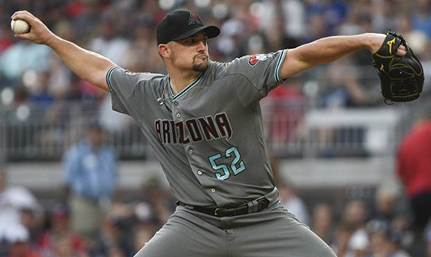 Arizona Diamondbacks' Zack Godley pitches against the Atlanta Braves during the first inning of a b...