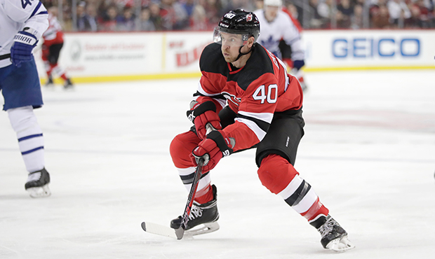 New Jersey Devils right wing Michael Grabner, of Austria, skates against the Toronto Maple Leafs du...