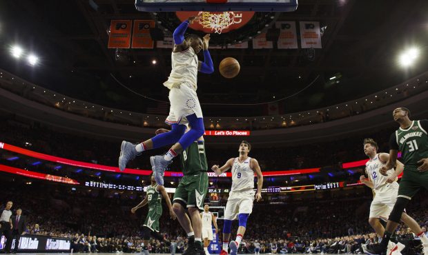 Philadelphia 76ers' Richaun Holmes, center, dunks the ball during the first half of an NBA basketba...