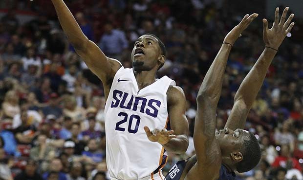 Phoenix Suns' Josh Jackson shoots as Dallas Mavericks' Jalen Jones defends during the second half o...