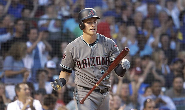 Arizona Diamondbacks' Jake Lamb reacts after striking out with the bases loaded to end the top half...