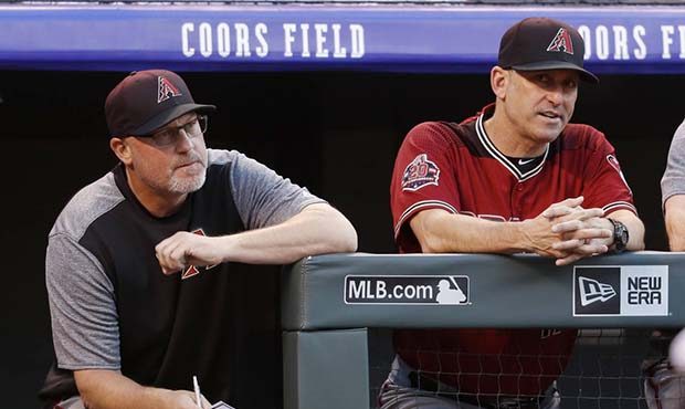 Arizona Diamondbacks pitching coach Mike Butcher, left, and manager Torey Lovullo watch as relief p...