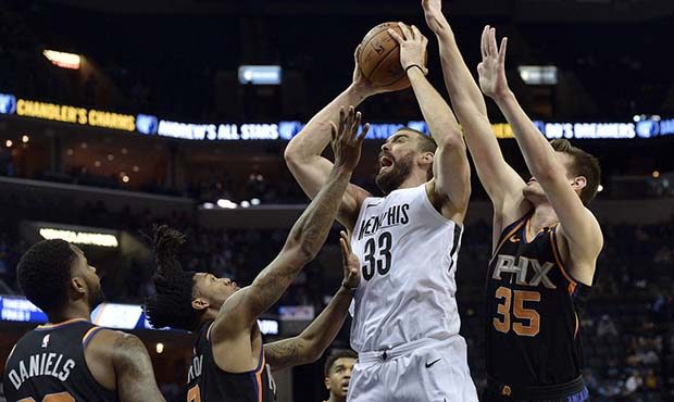 Memphis Grizzlies center Marc Gasol (33) shoots against Phoenix Suns guard Troy Daniels (30), guard...