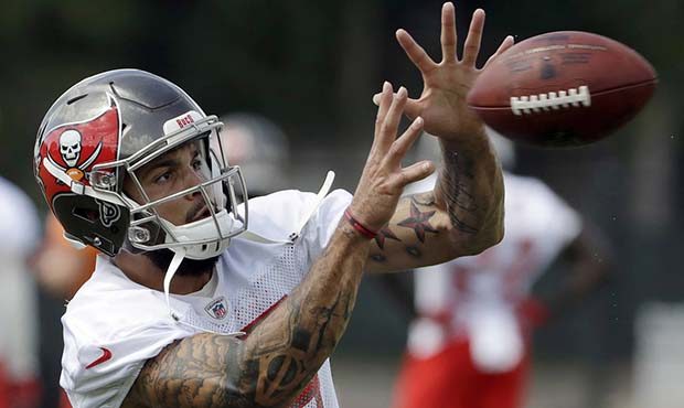 Tampa Bay Buccaneers wide receiver Mike Evans (13) catches a pass during an NFL football minicamp T...