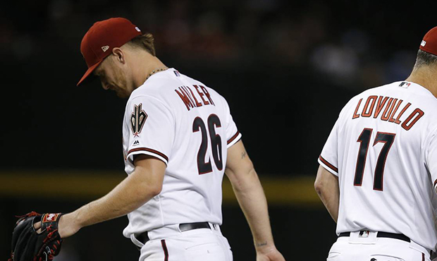 Arizona Diamondbacks starting pitcher Shelby Miller (26) is removed from the game by manager Torey ...
