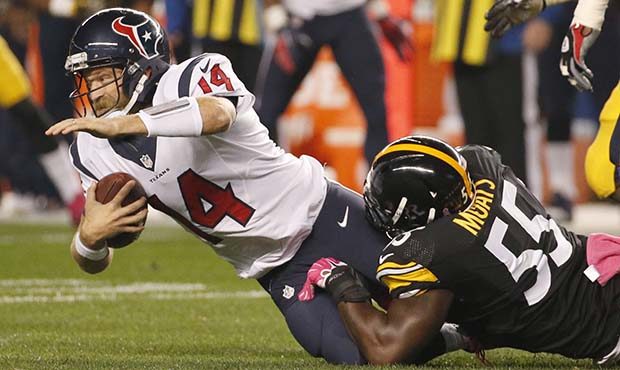 Houston Texans quarterback Ryan Fitzpatrick (14) is tackled by Pittsburgh Steelers outside lineback...