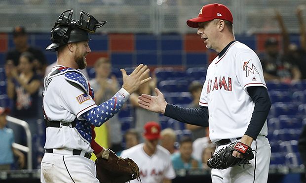 Miami Marlins relief pitcher Brad Ziegler, right, and catcher Bryan Holaday celebrate after the Mar...