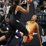 Phoenix Mercury forward DeWanna Bonner (24) fouls Las Vegas Aces center Kelsey Bone during the first half of a WNBA basketball game Wednesday, Aug. 1, 2018, in Las Vegas. (AP Photo/John Locher)