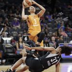Las Vegas Aces guard Jaime Nared (31) falls to the floor after fouling Phoenix Mercury guard Diana Taurasi (3) during the first half of a WNBA basketball game Wednesday, Aug. 1, 2018, in Las Vegas. (AP Photo/John Locher)